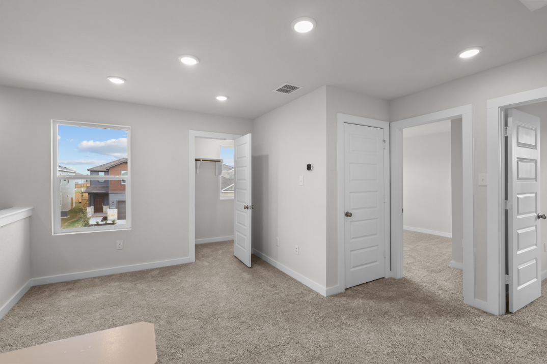 A room with white cabinets.