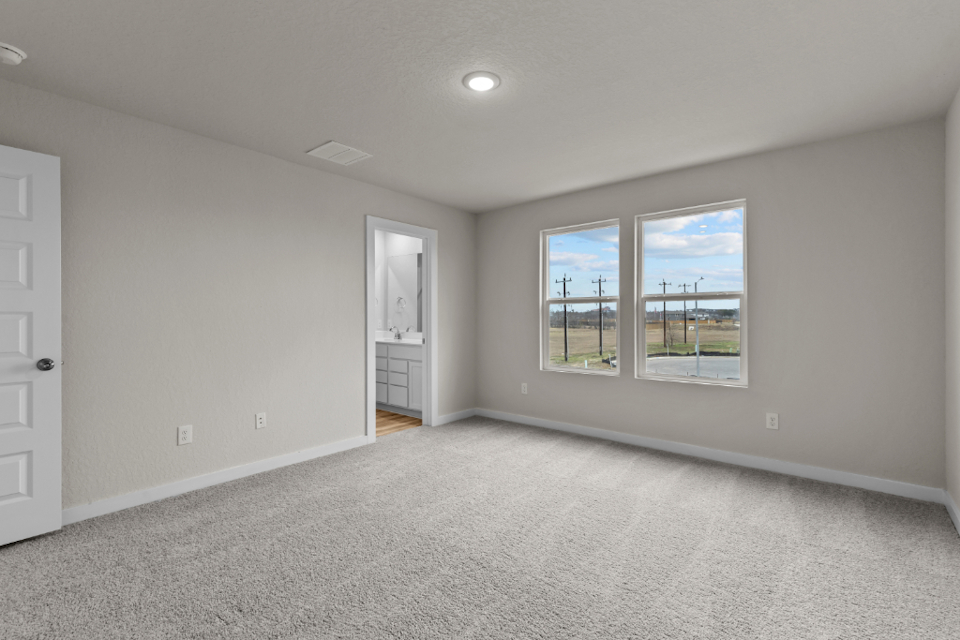 A room with a window and a door.
