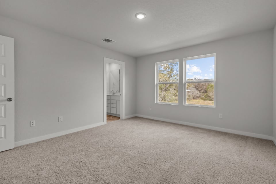 A room with a window and a door.