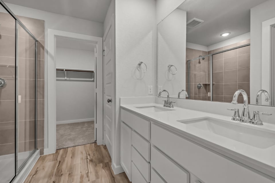 A bathroom with a glass shower.