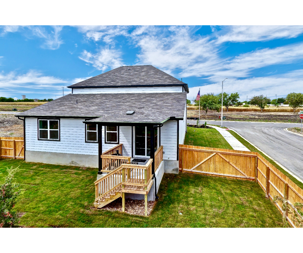 A house with a fence around it.