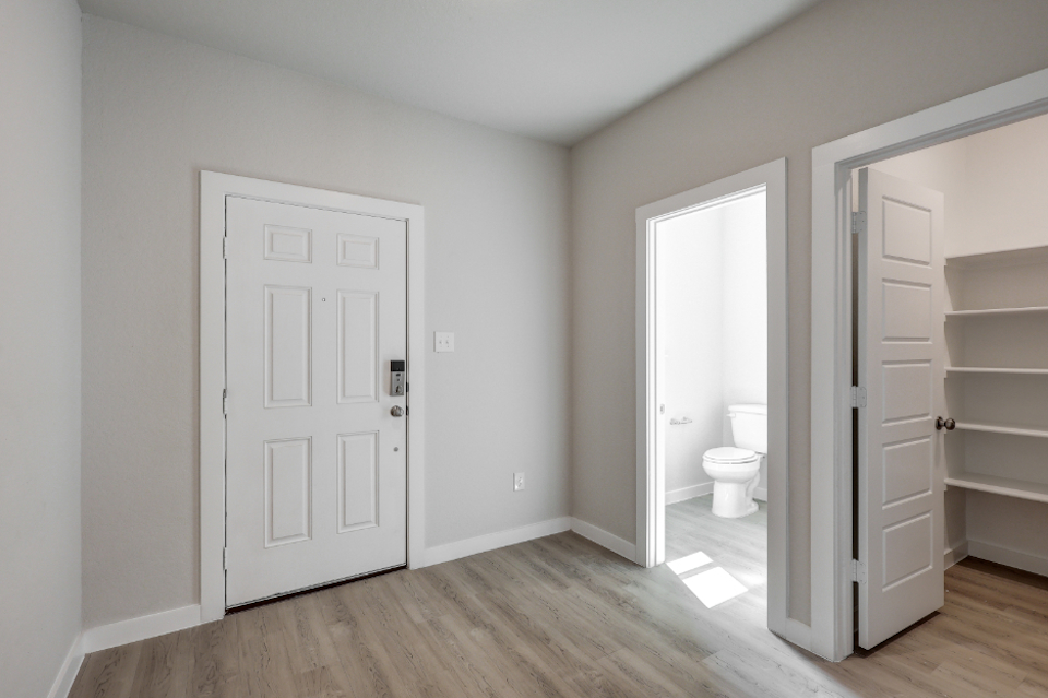 A bathroom with white doors.