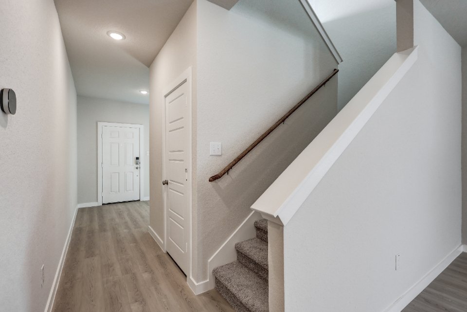A hallway with white doors.