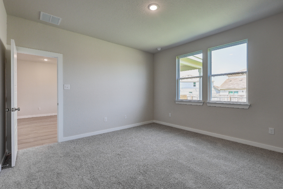 A room with a window and a door.