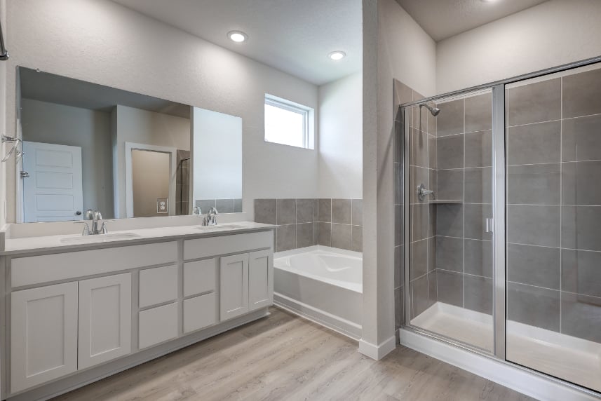 A bathroom with a glass shower.