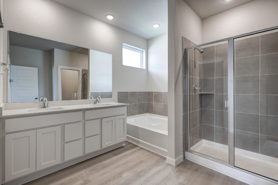 A bathroom with a glass shower.