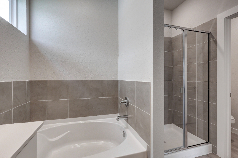 A bathroom with a glass shower.