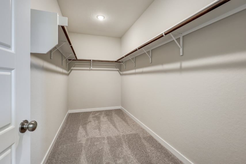 A white room with a staircase.