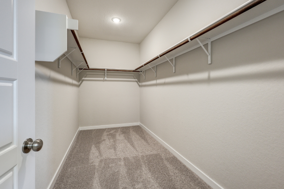 A white room with a staircase.