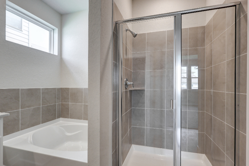 A bathroom with a glass shower.