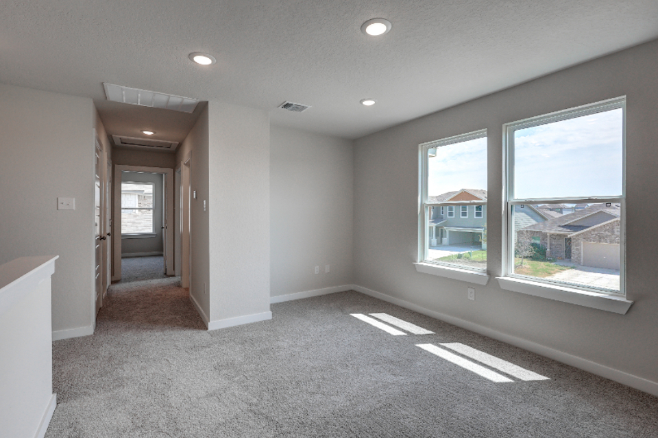 A room with a window and a door.