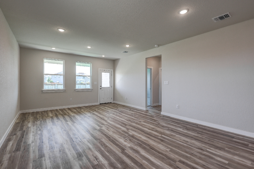 A room with a wood floor and a wood floor.
