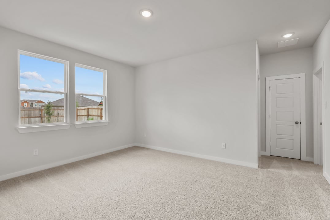 A room with a window and a door.