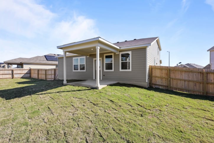 A house on a grassy hill.