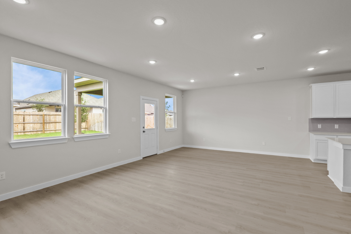 A room with white walls and windows.