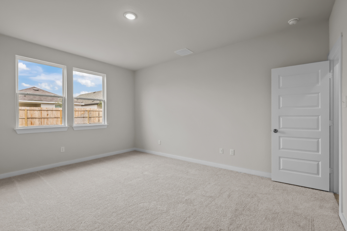 A room with a window and a door.