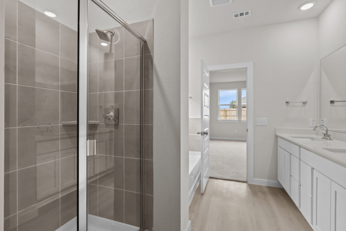A bathroom with a glass shower.