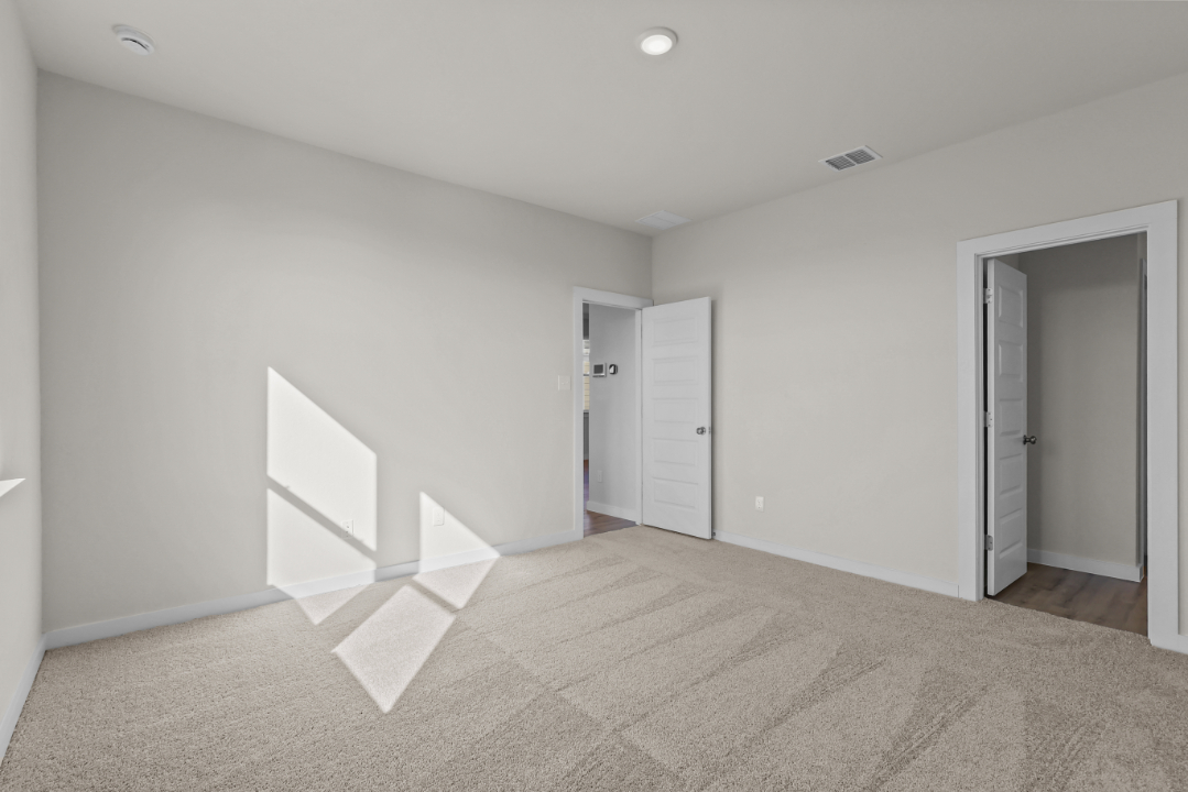 A hallway with white doors.