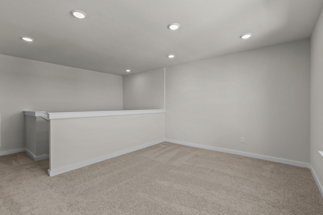 A room with a white wall and a white floor.