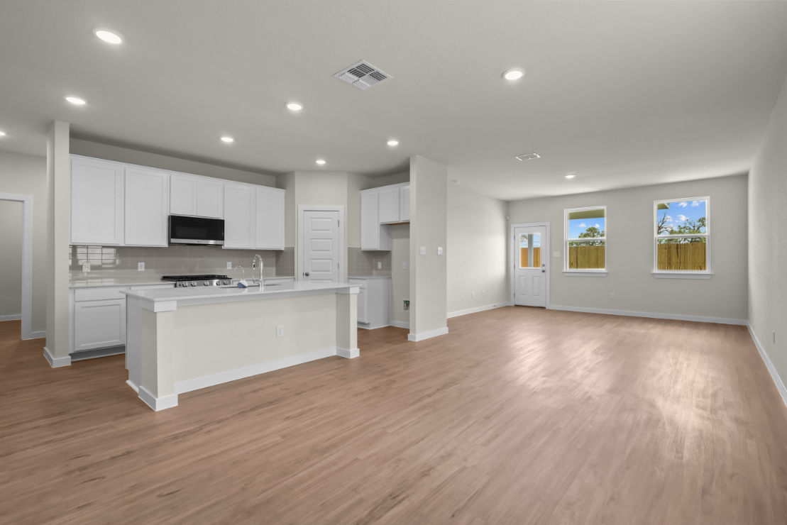 A large kitchen with white cabinets.