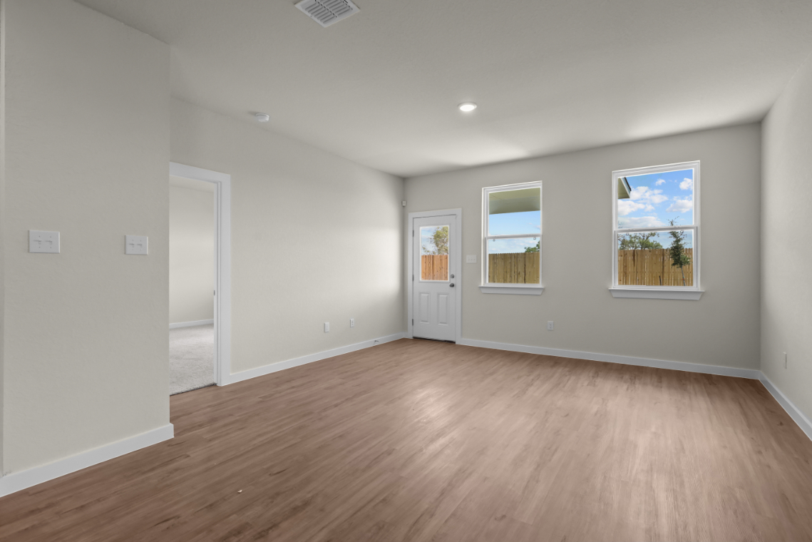 A room with a wood floor and a wood floor.