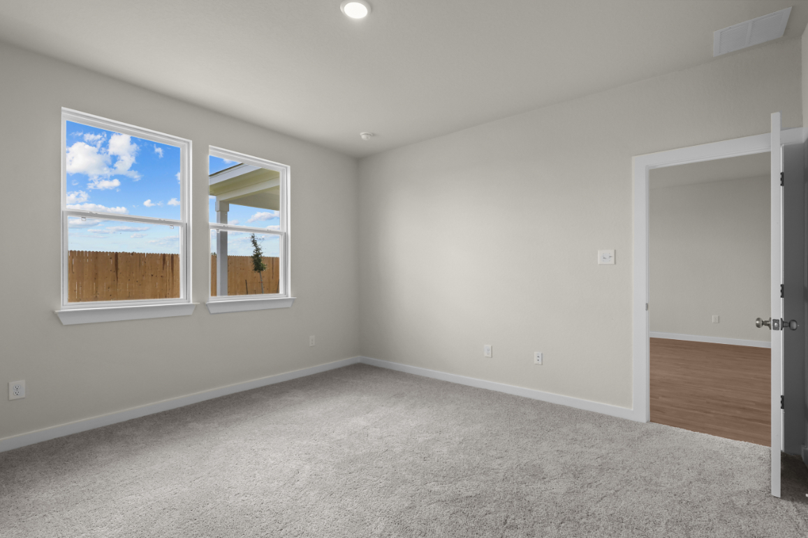 A room with a door and a window.