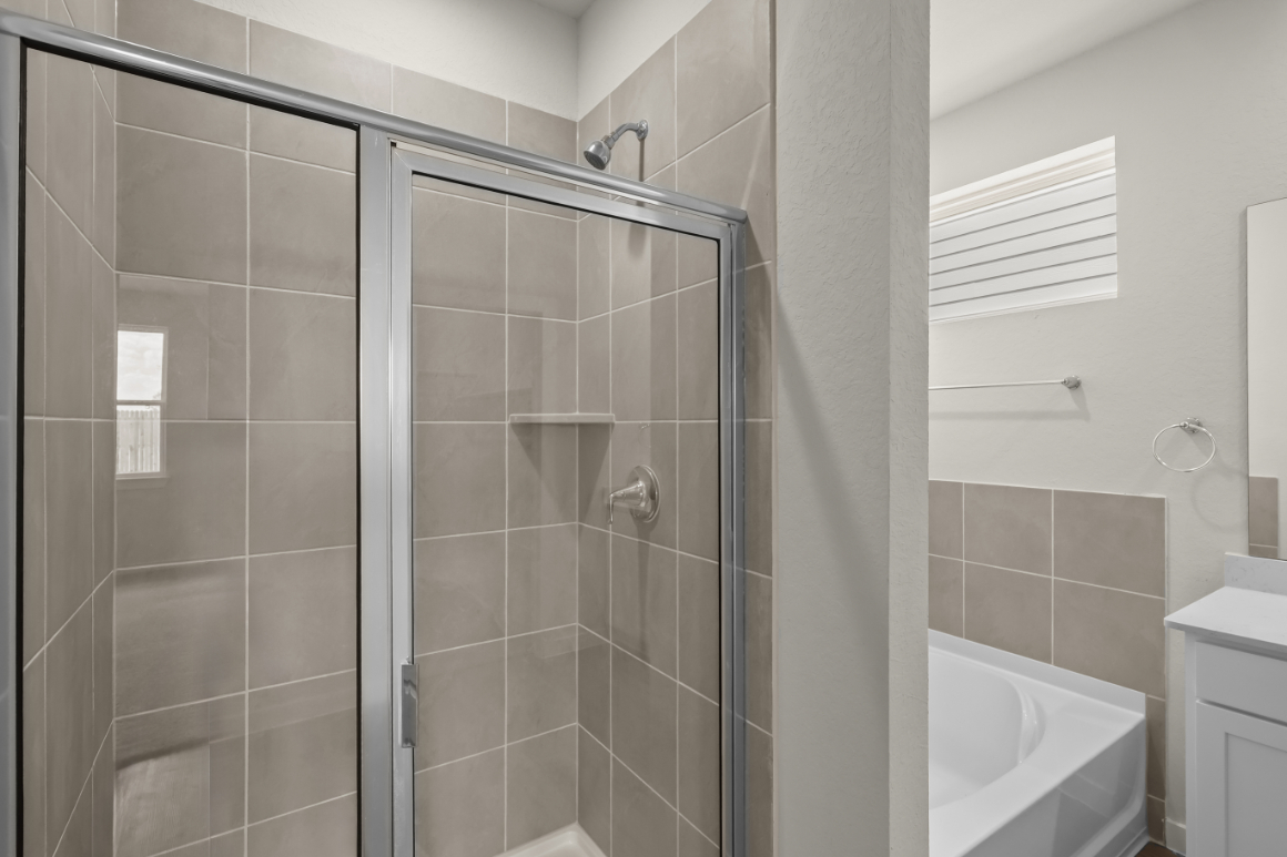 A bathroom with a glass shower.