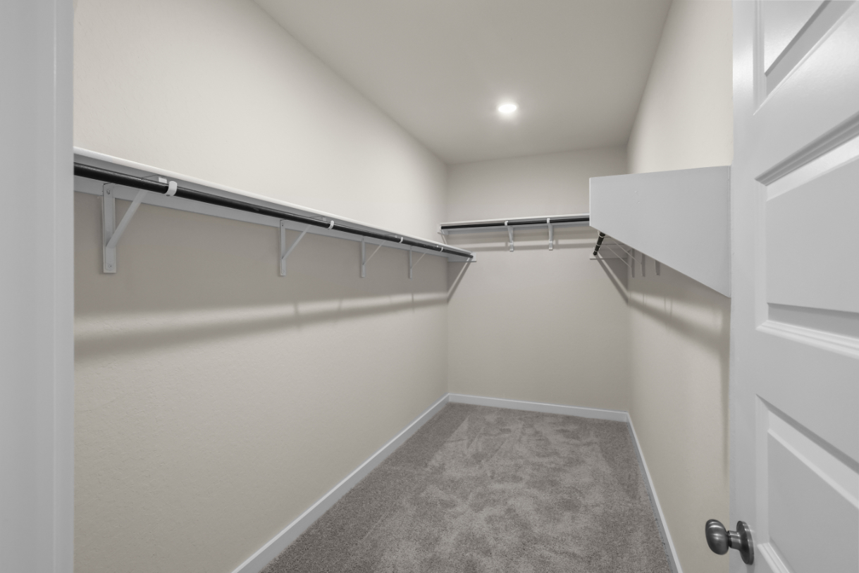 A hallway with white walls.