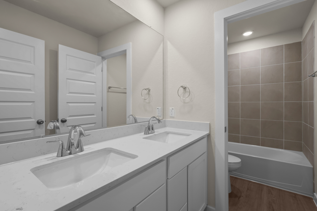A bathroom with two sinks.