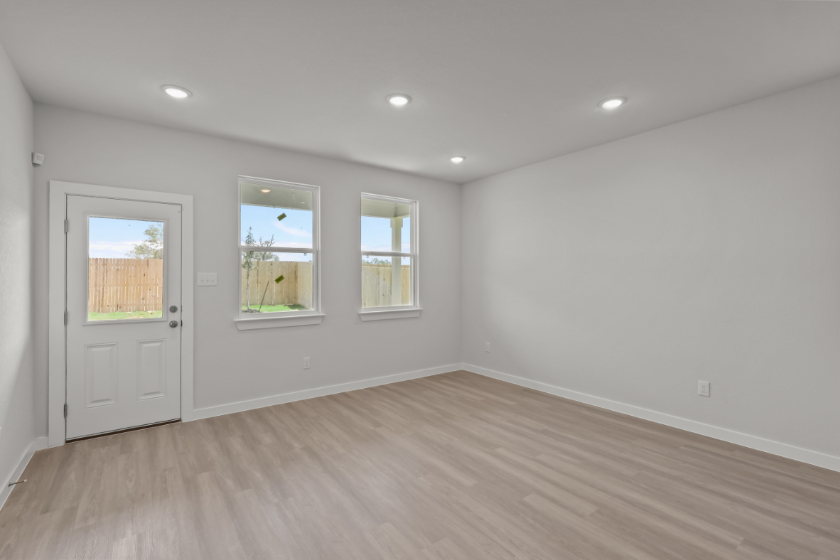 A room with white walls and windows.