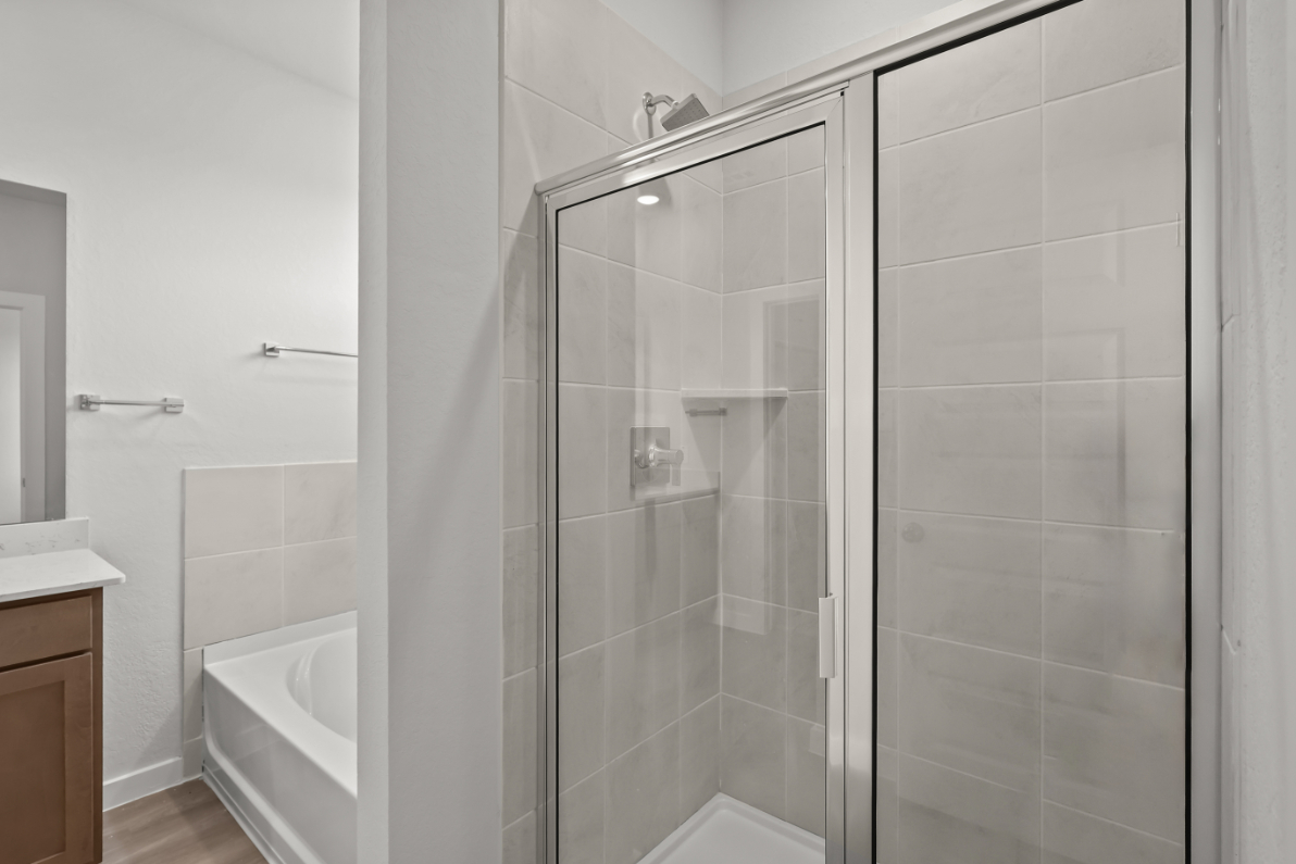 A bathroom with a glass shower.