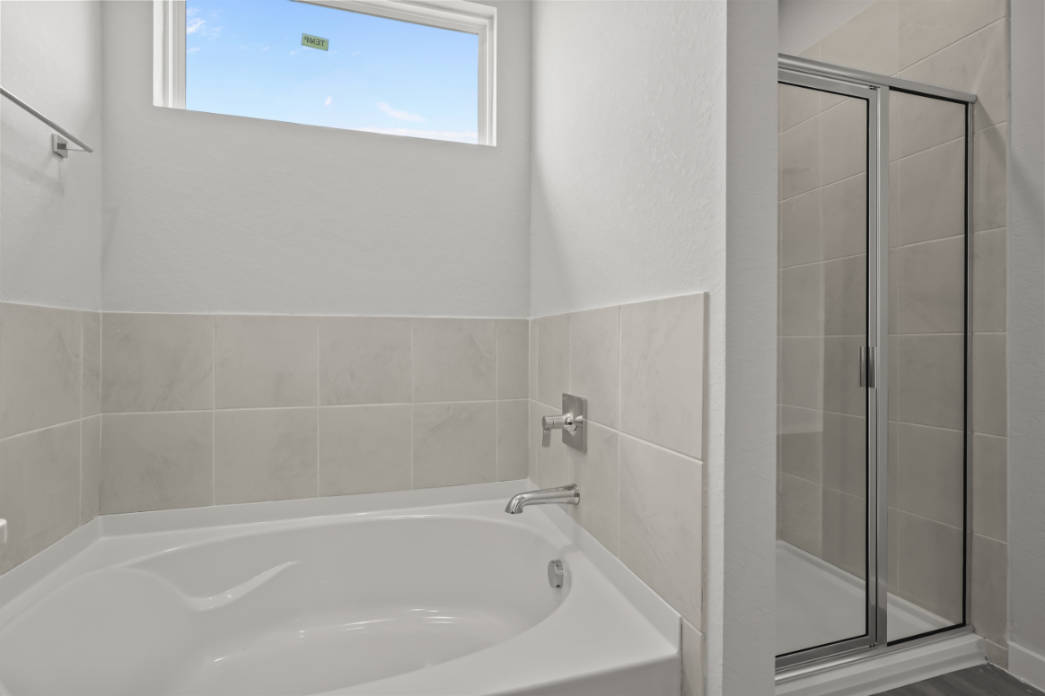 A bathroom with a glass shower.