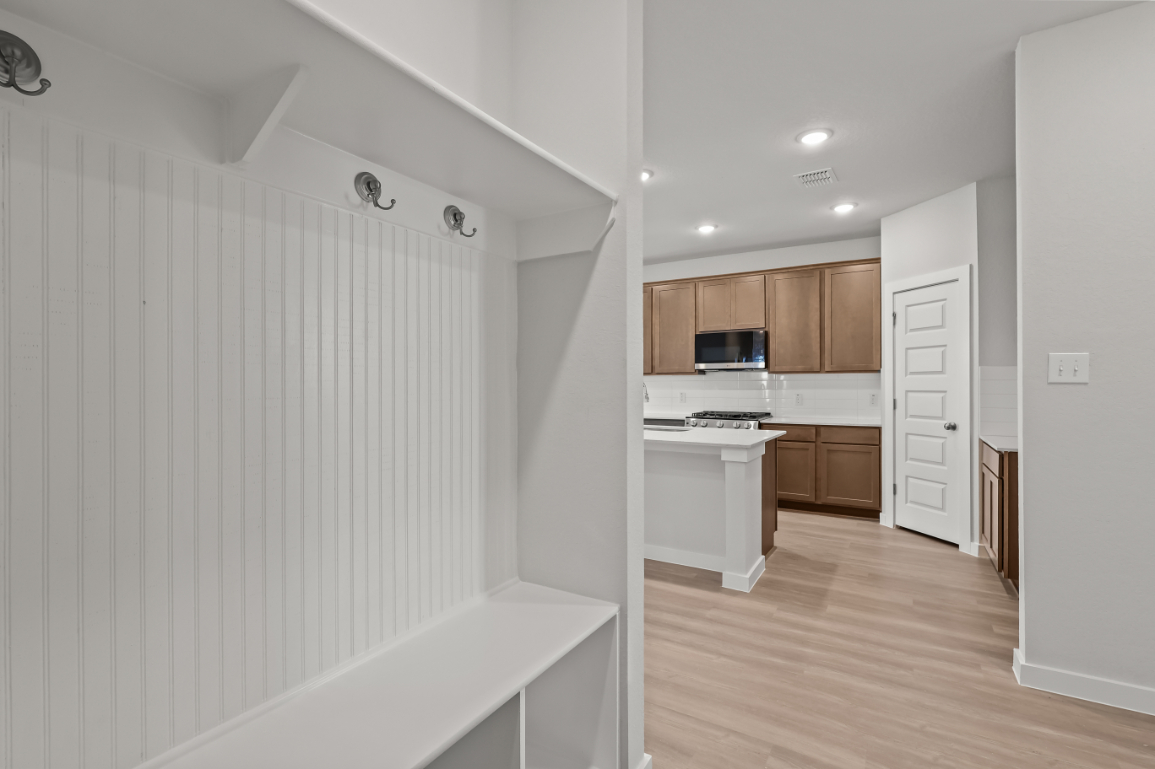 A kitchen with white walls.