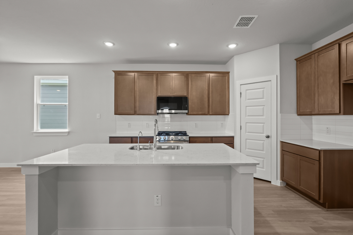 A kitchen with a large island.