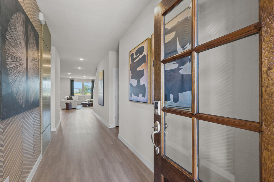 A hallway with art on the walls.