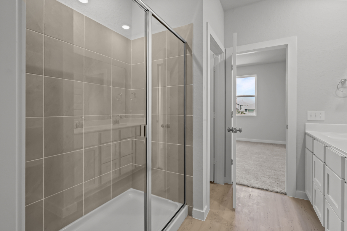 A bathroom with a glass shower.