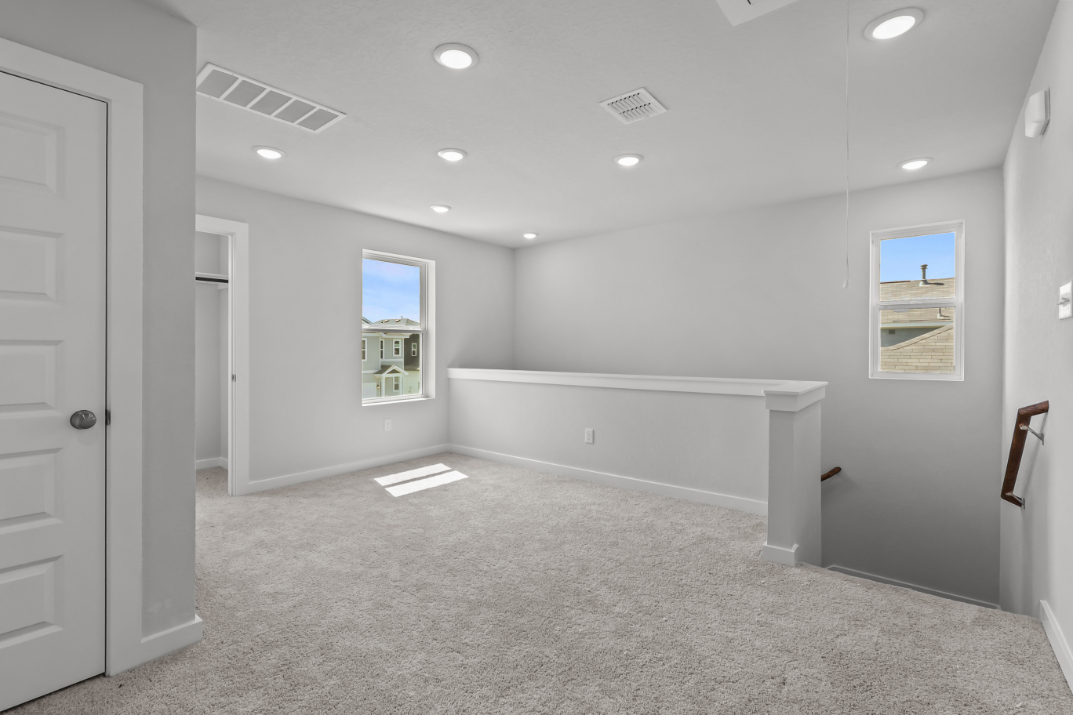 A room with a white carpet and a white floor.