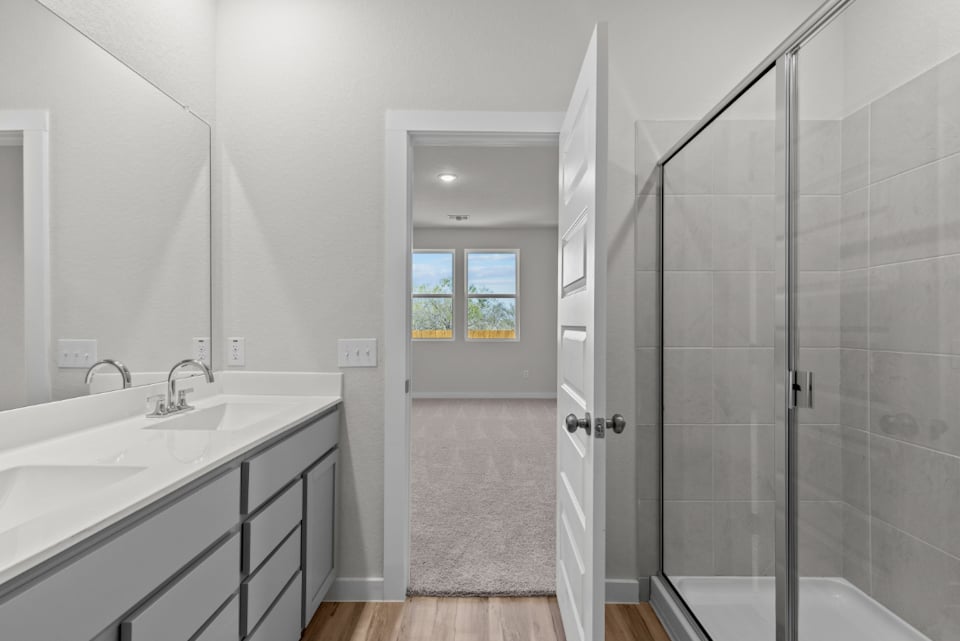 A bathroom with a glass shower.