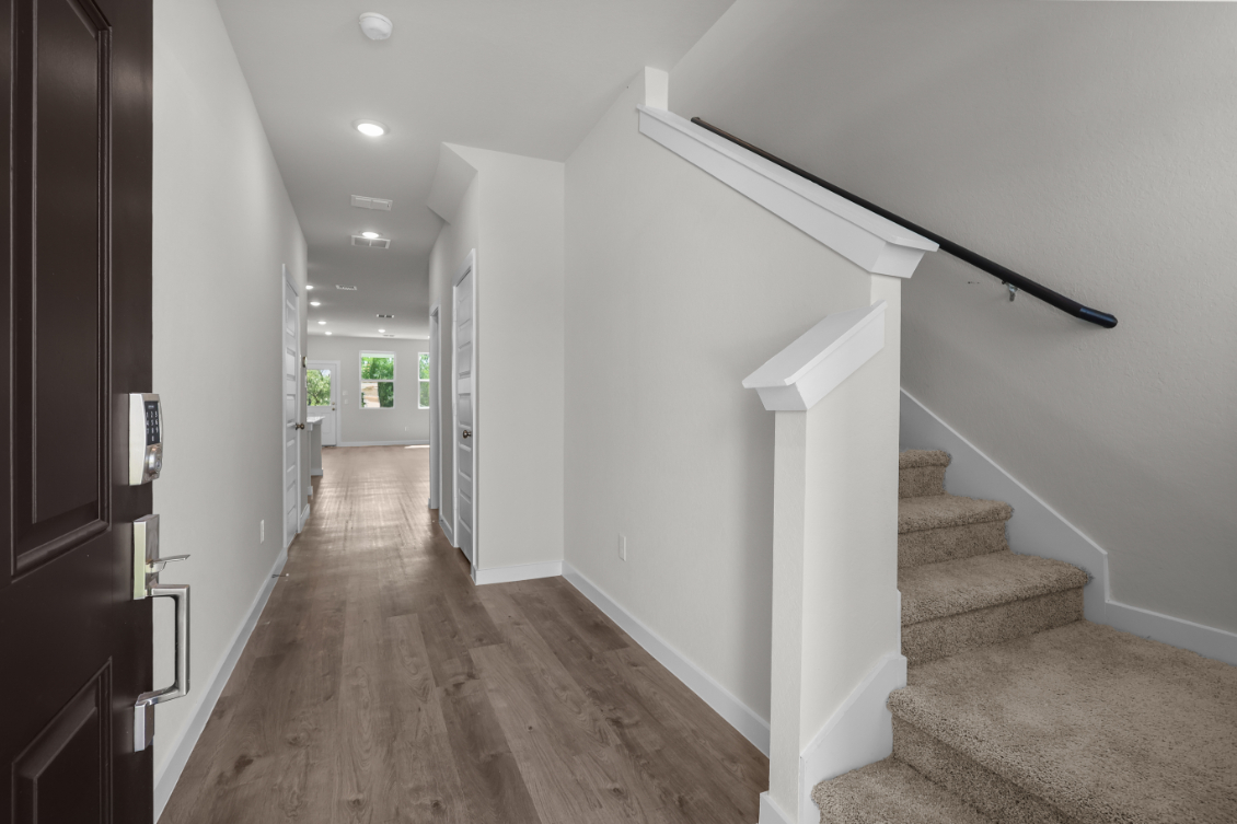 A hallway with white walls.
