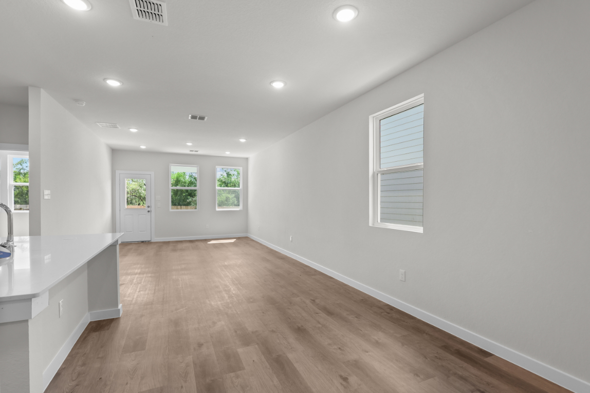 A large empty room with white walls.