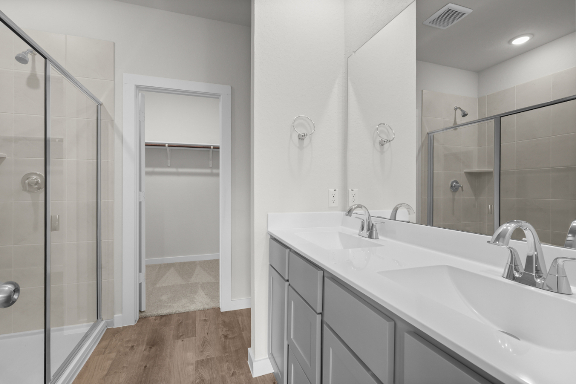A bathroom with a glass shower.