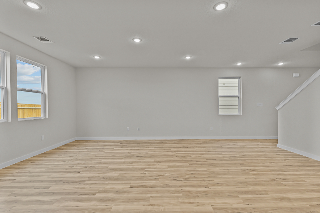 A room with a wood floor and a wood floor.