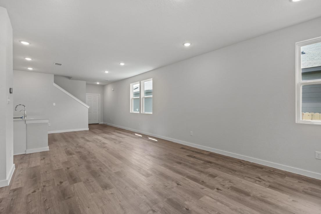 A room with a wood floor and a wood floor.