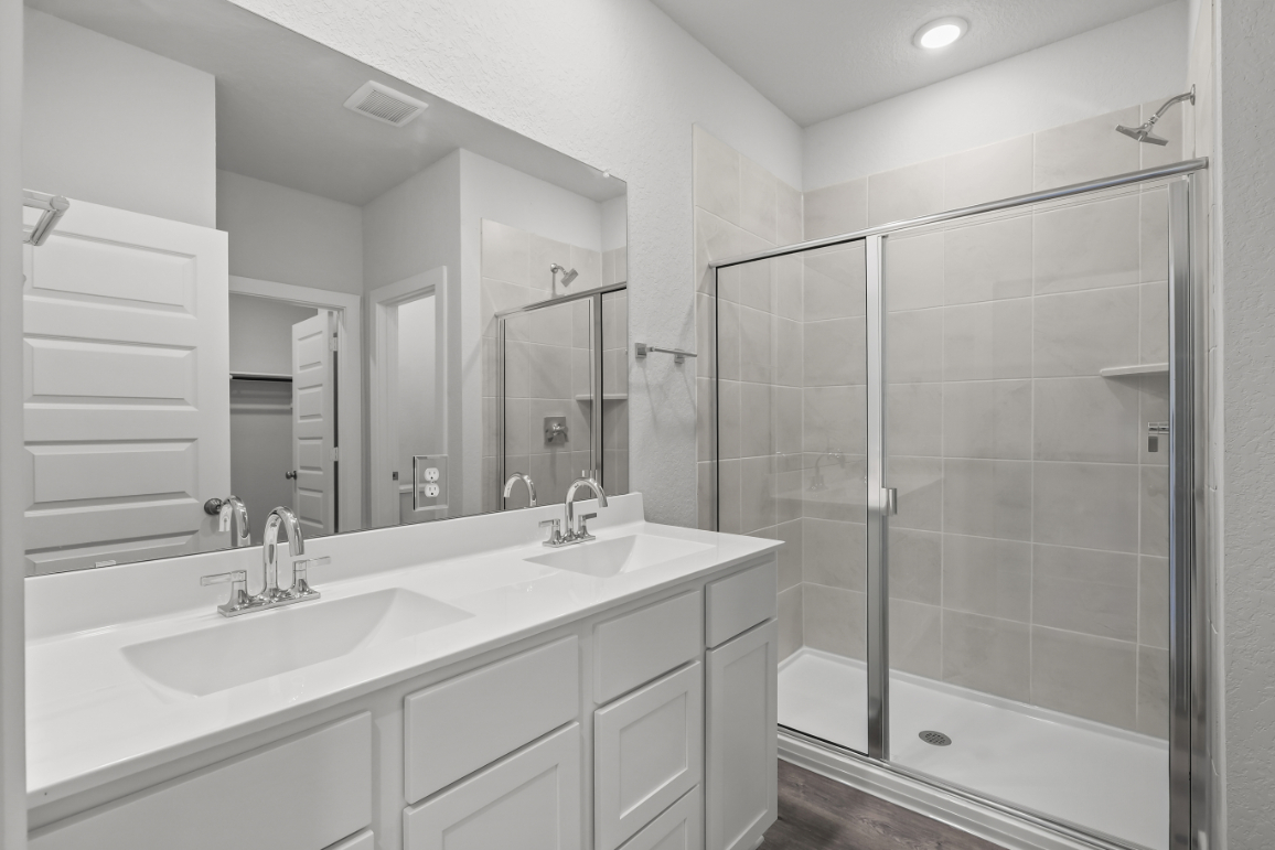 A bathroom with a glass shower.