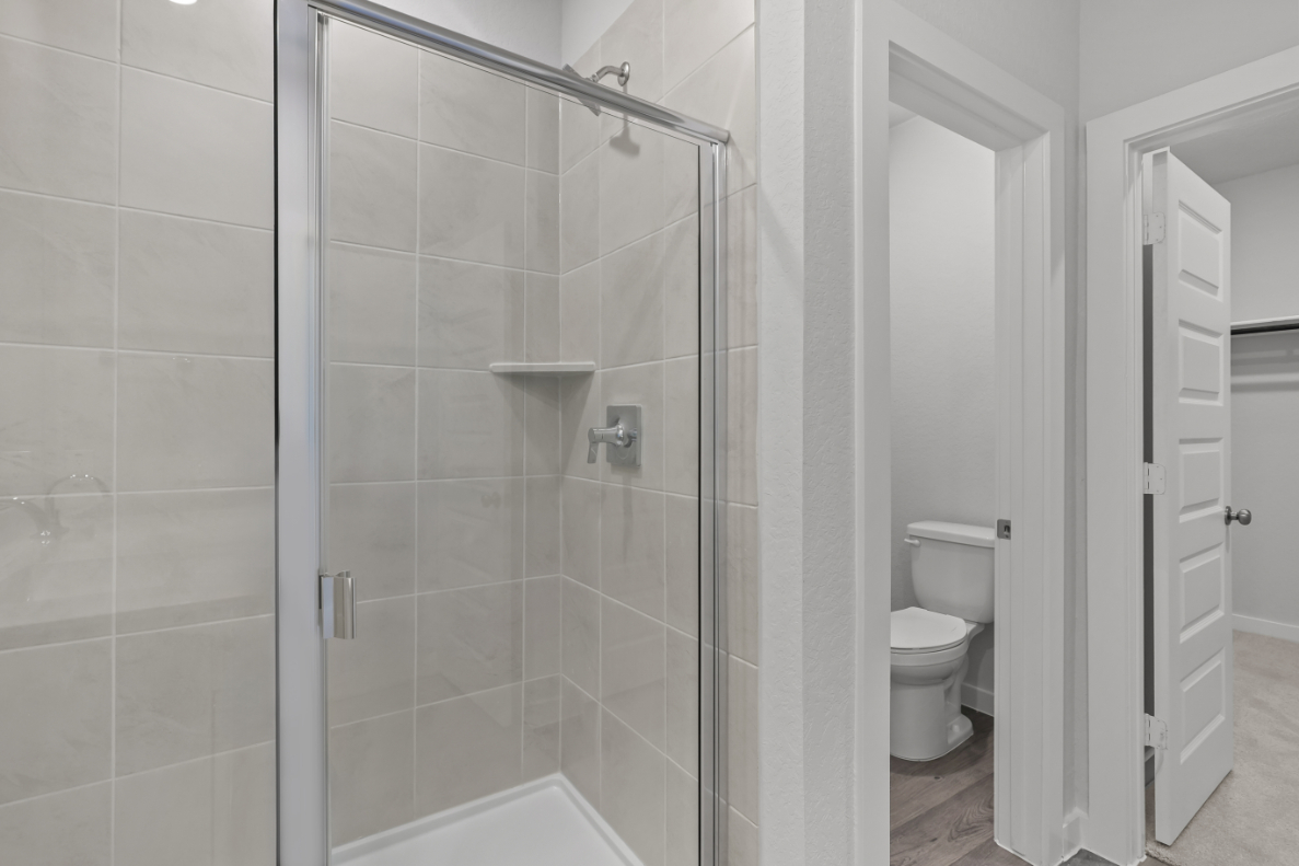 A bathroom with a glass shower.