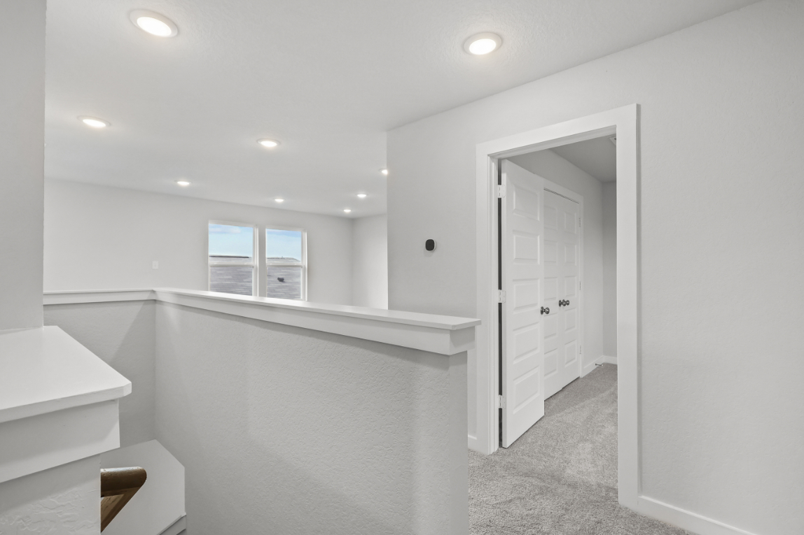 A bathroom with a white shower.