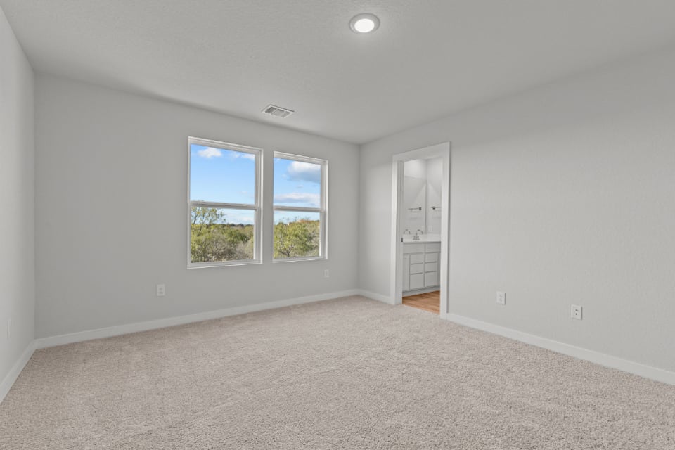A room with a window and a door.