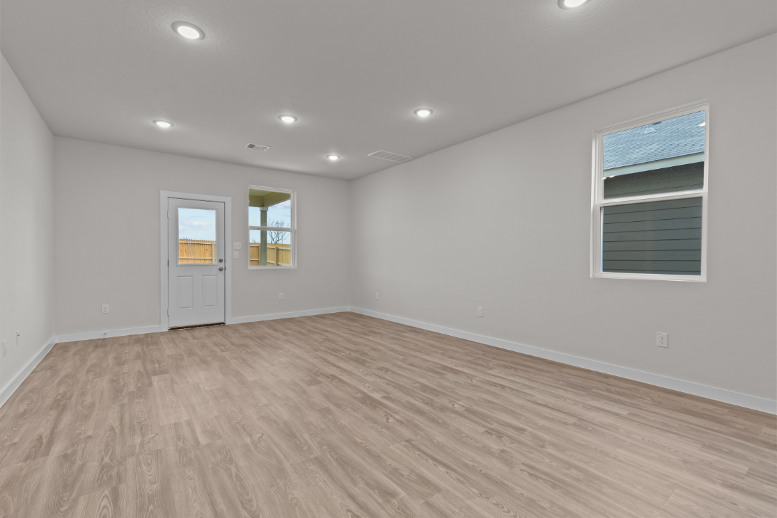 A room with a wood floor and a wood floor.