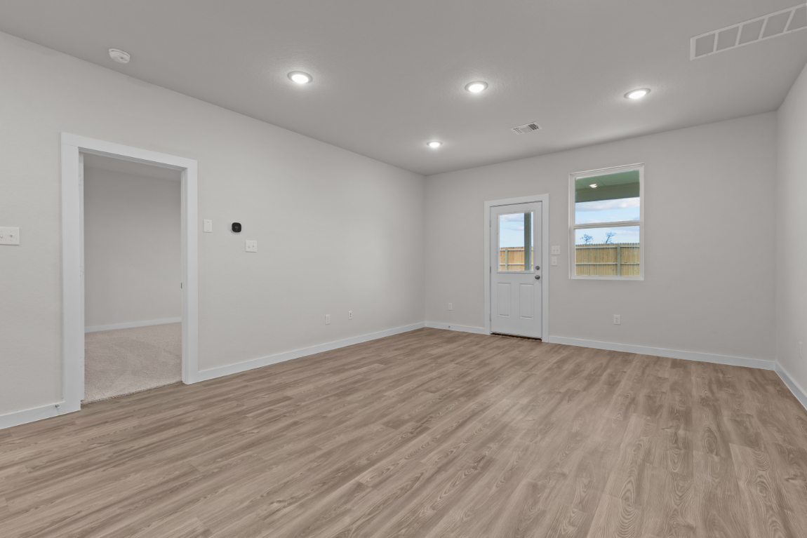 A room with a wood floor and a wood floor.