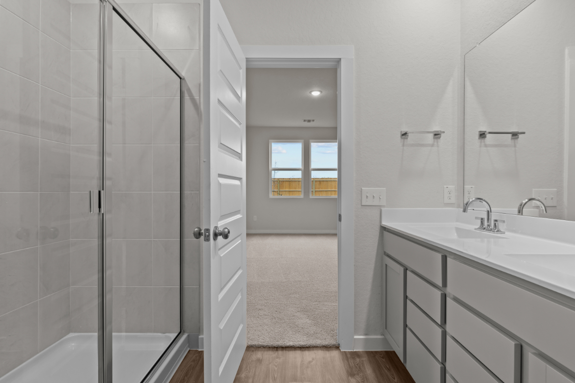 A bathroom with a glass shower.